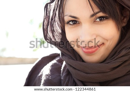 Close up beauty portrait of a muslim young woman wearing a head scarf and smiling at - stock-photo-close-up-beauty-portrait-of-a-muslim-young-woman-wearing-a-head-scarf-and-smiling-at-the-camera-122344861