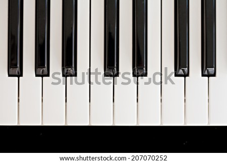 Over head close-up detail view of a piano keyboard black and white keys, interior. (Object, Music, Entertainment).