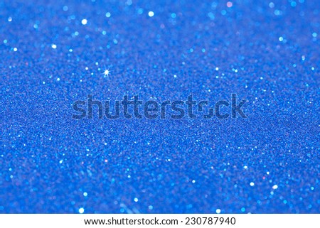 Abstract blue color glitter festive background frame with shining stars and galaxy like feel. Christmas decorative and festivity celebration background texture. Luxury texture white glitter.