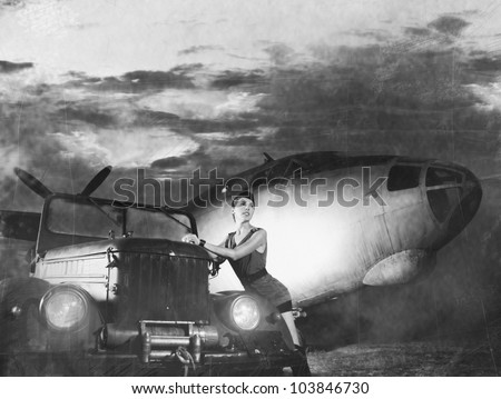 Young attractive female soldier with the plane and car (WARNING! There are noise, dust and scratches on the image)