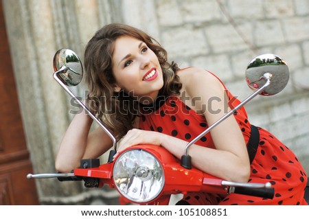 Vintage image of young attractive girl and old scooter