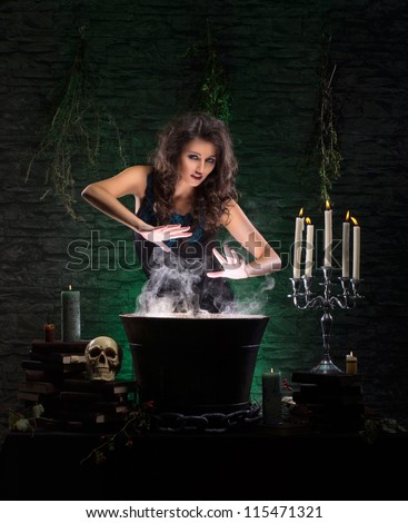 Young sexy witch making the witchcraft in the dungeon