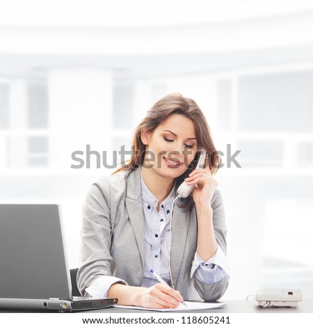 Business woman working in office on white