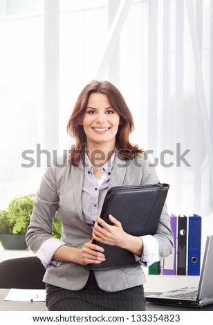 Young and attractive business woman working  in office