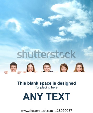 Group of teenagers with a giant, blank, white billboard over the sky background
