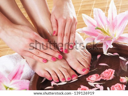Spa Background With A Beautiful Legs, Flowers, Petals And Ceramic Bowl