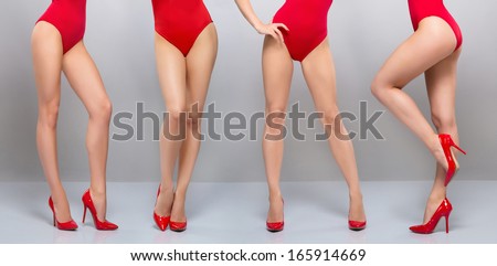 Beautiful Legs Of Young And Sporty Woman In Red Swimsuit Over Grey Background
