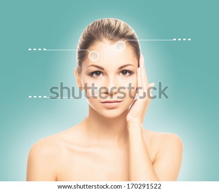 Close-up portrait of young, fresh and natural woman with the dotted arrows (spa, surgery, face lifting and make-up concept)