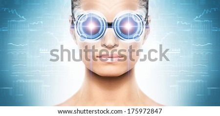 Young and attractive woman from future with the laser hologram on her eyes (collage about eye scanning technology)