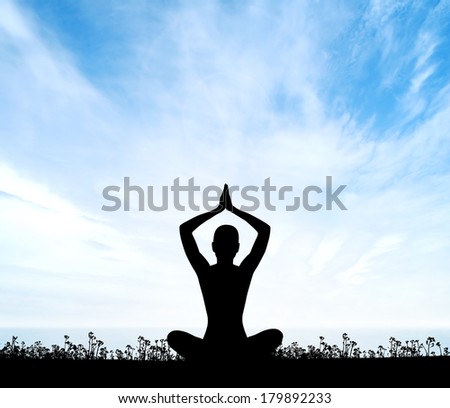 Meditation. Silhouette of a woman doing yoga exercises.