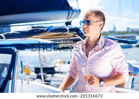 Young and handsome man on a luxury yacht