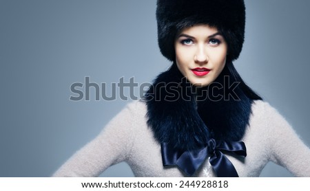 Fashion style portrait of a woman in an elegant winter fury clothes