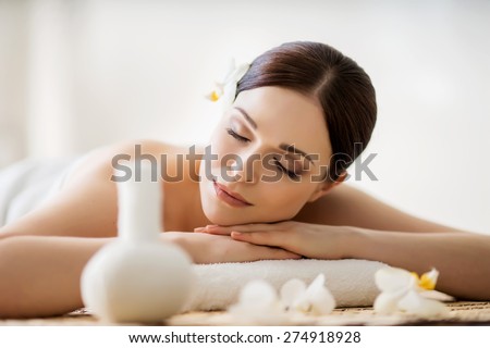 Young, beautiful and healthy woman in spa salon. Traditional oriental aroma therapy and beauty treatments.