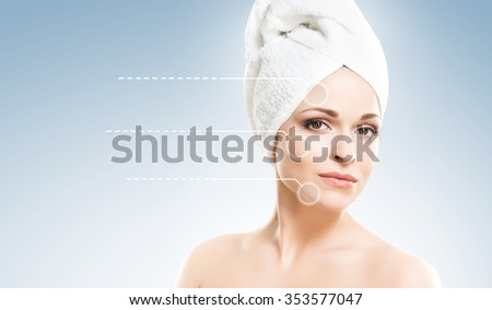 Spa portrait of a young and healthy woman with pointer arrows on her face. Plastic surgery concept.