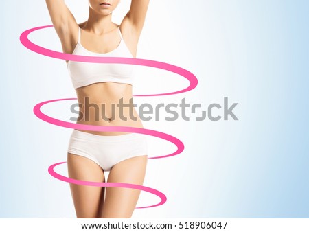 Close-up of thin and beautiful female body. Weight loss, fat burn, sports, exercising concept. Red arrows.