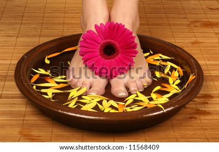 Spa composition of legs and flowers