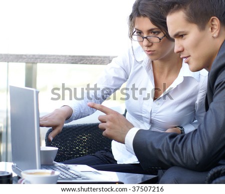 Business couple (Warning! Only woman\'s face is in focus, man\' face is out of focus!)