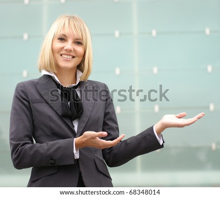 Young attractive business woman over modern background