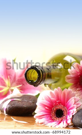 Spa composition (Warning! Only the bottle neck and a part of the flower are in focus)