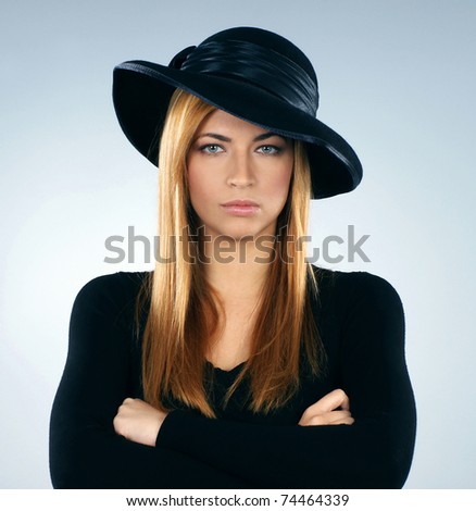 Young attractive widow over grey background