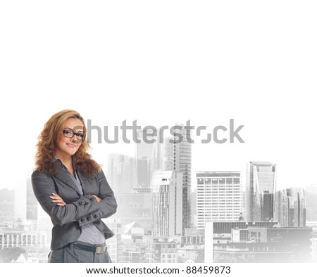 Young and attractive business woman over city background