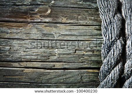 Image of old texture of wooden boards with ship rope