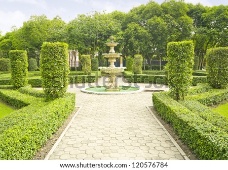 English garden in summer, Lush Green Topiary