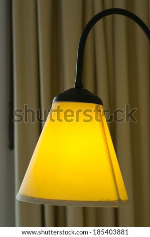 close up yellow lamp with curtain