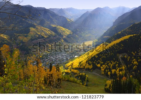 overlook over Telluride with golden, green and red aspen in Colorado