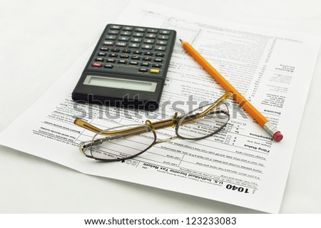 preparation of Internal Revenue Service form 1040 for income report and US tax return