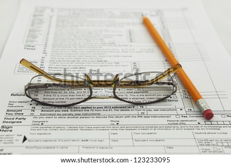 preparation of Internal Revenue Service form 1040 for income report and US tax return