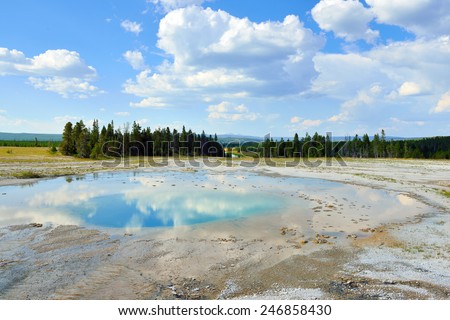 Midway Geyser Basin and reflection of clouds in Yellowstone National Park, Wyoming