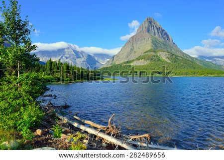 Swiftcurrent lake in high alpine landscape on the Grinnell Glacier trail, Glacier national park, Montana in summer