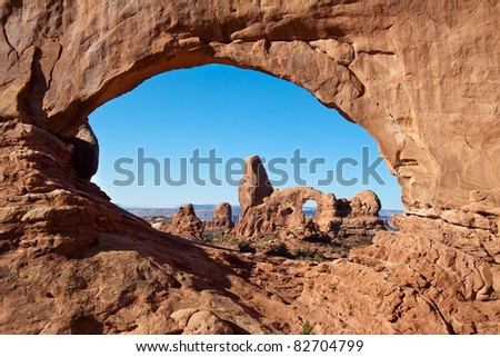 Turret Arch framed by North Window in the Arches National Park, Utah