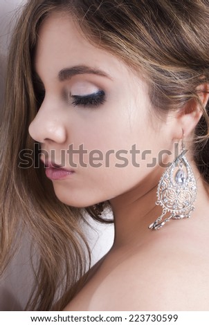 woman portrait with silver jewel side view