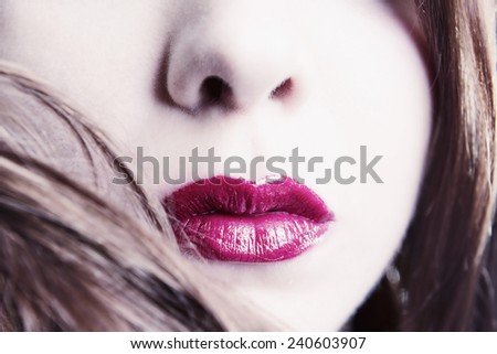 High Key Close-up Of Woman\'s Face With Vibrant Red Lipstick