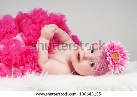 Baby girl in pink with flower headband