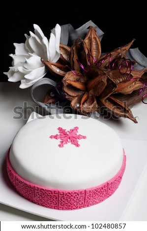 beautiful wedding cake with pink snowflake star