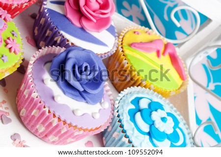 loads of colorful cupcakes for birthday or wedding party