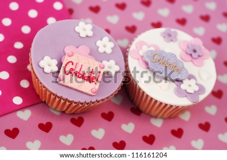 Romantic valentine or wedding cupcakes on a heart background