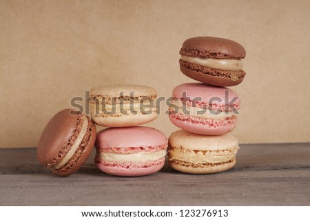 loads of macaroons in brown pink and yellow