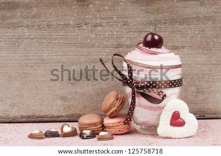 Cupcake towel give away with macaroons and chocolate hearts