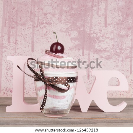 the word love with towel cupcake give away. Valentine or wedding card design