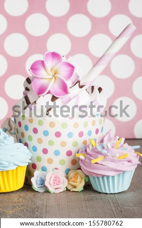 cupcakes with flower decoration and sprinklers