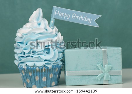 Happy birthday cupcake with present in baby blue
