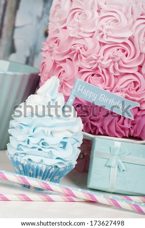 Happy birthday cupcake with birthday cake and present
