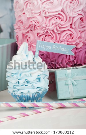 Happy birthday cupcake with birthday cake and present