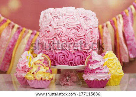 Beautiful lemonade cotton candy theme birthday setting with cake and cupcakes