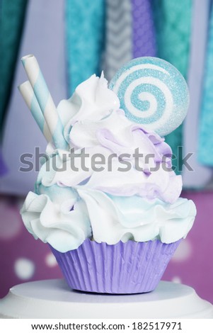 festive cupcake with straws and candy mint