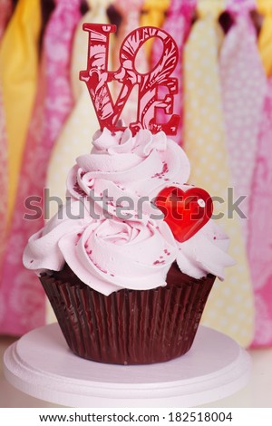 Romantic Valentine cupcake with the text love